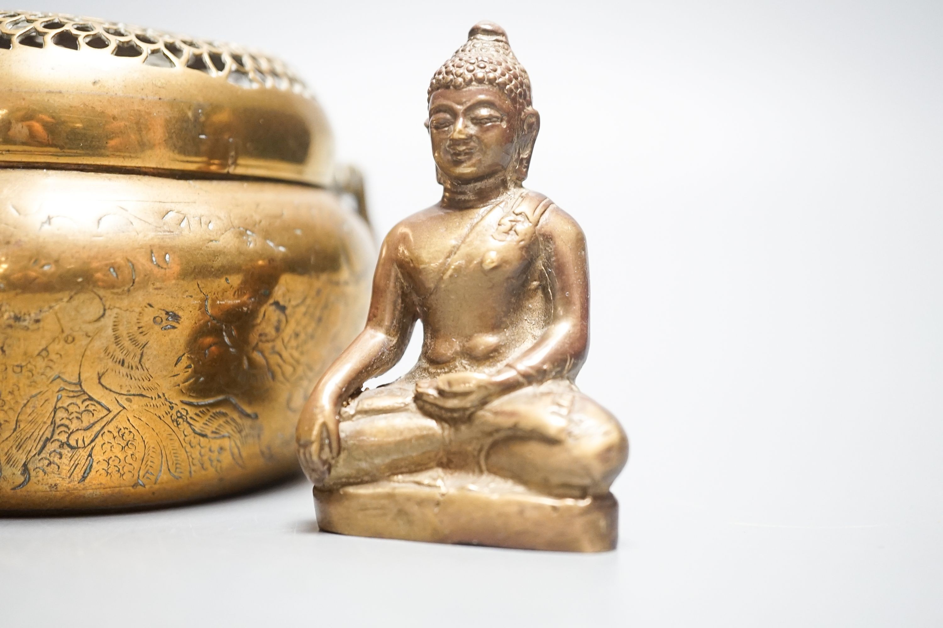 A bronze hand warmer with Xuande mark, 10 cm wide and two Himalayan Buddhist figures, tallest 6.8 cm (3)